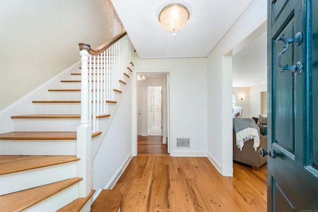 1208 Smith Ridge Rd, New Canaan, CT 06840 - foyer featuring stairway, light wood-type flooring, and baseboards