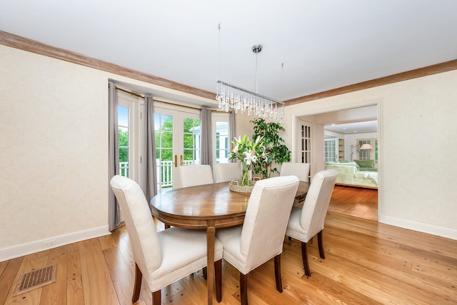 1208 Smith Ridge Rd, New Canaan, CT 06840 - dining space with baseboards, light wood finished floors, crown molding, and a chandelier