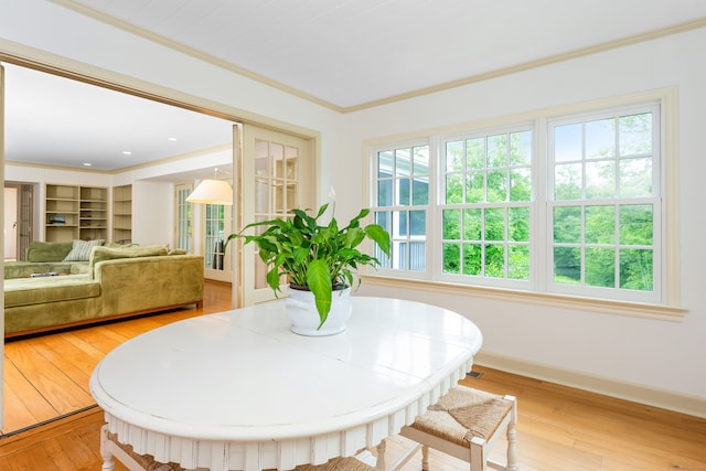 1208 Smith Ridge Rd, New Canaan, CT 06840 - dining space with light wood-style flooring, ornamental molding, and baseboards