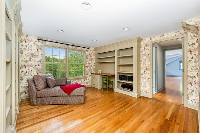 1208 Smith Ridge Rd, New Canaan, CT 06840 - living area with wallpapered walls, light wood-style flooring, and baseboards
