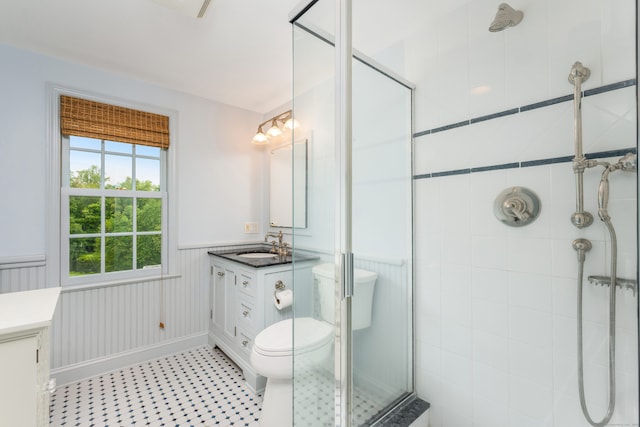 1208 Smith Ridge Rd, New Canaan, CT 06840 - full bath featuring a stall shower, vanity, wainscoting, and toilet
