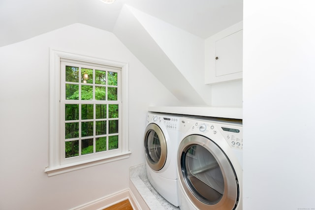 1208 Smith Ridge Rd, New Canaan, CT 06840 - laundry area with washing machine and clothes dryer, baseboards, and wood finished floors
