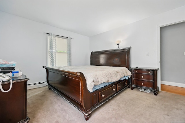 5 Stevens St, Bridgeport, CT 06606 - bedroom featuring a baseboard heating unit, light carpet, and baseboards