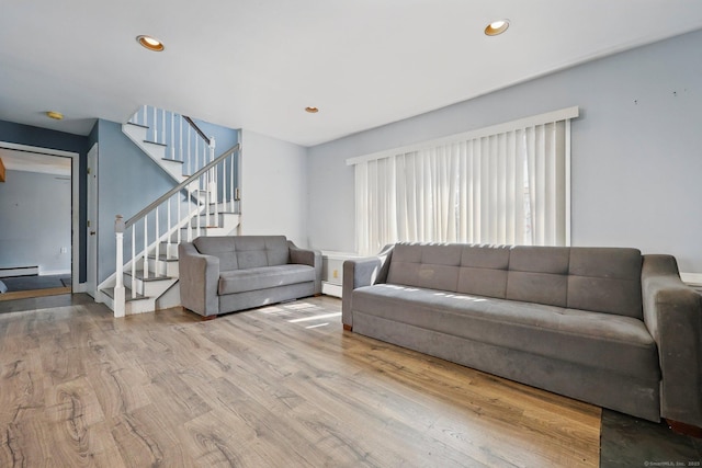 5 Stevens St, Bridgeport, CT 06606 - living room featuring wood finished floors, stairs, a baseboard heating unit, and recessed lighting