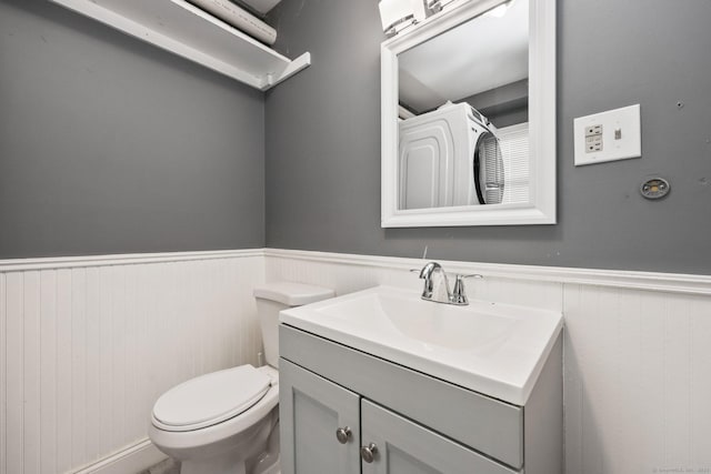 5 Stevens St, Bridgeport, CT 06606 - half bath with a wainscoted wall, vanity, and toilet