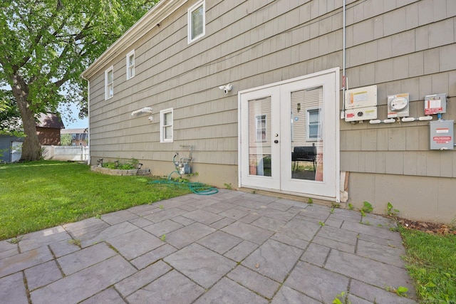 5 Stevens St, Bridgeport, CT 06606 - view of exterior entry with a patio and a lawn