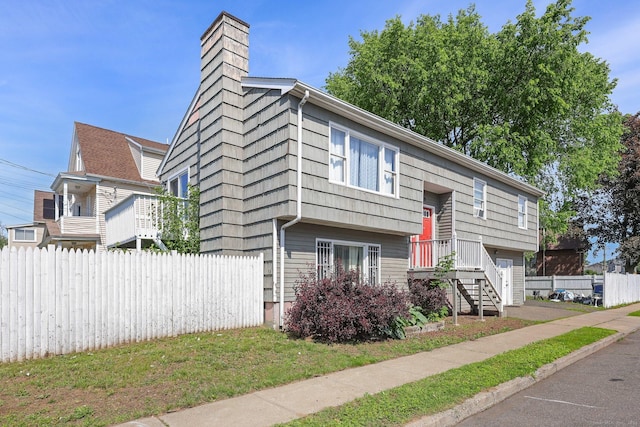 5 Stevens St, Bridgeport, CT 06606 - view of front facade featuring a chimney