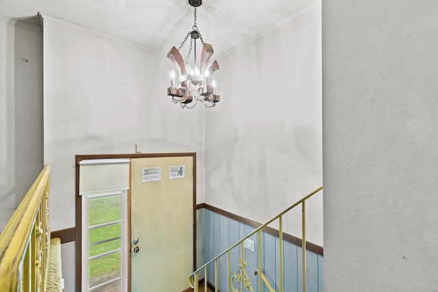 108 Gallivan Ln, Montville, CT 06382 - entryway with a chandelier and ornamental molding