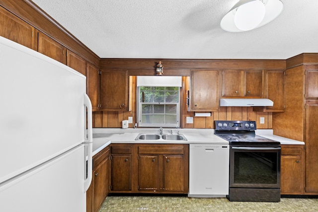108 Gallivan Ln, Montville, CT 06382 - kitchen with white appliances, under cabinet range hood, a sink, light countertops, and a textured ceiling