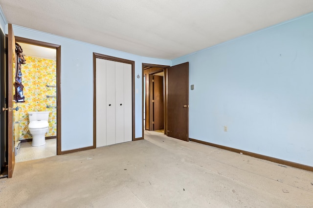 108 Gallivan Ln, Montville, CT 06382 - unfurnished bedroom with a closet, baseboards, ornamental molding, and ensuite bath