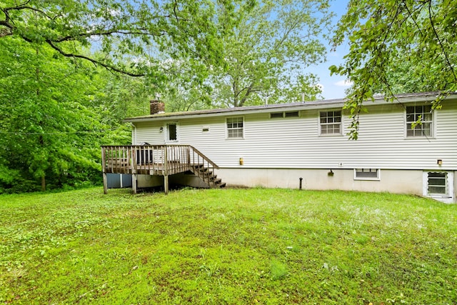 108 Gallivan Ln, Montville, CT 06382 - rear view of property with a chimney, a wooden deck, and a yard