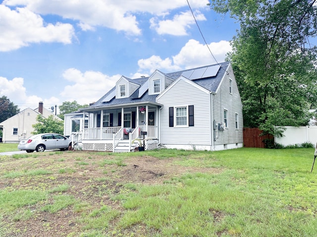 29 Hooker Rd, Bridgeport, CT 06610 - cape cod-style house featuring a porch, solar panels, and roof with shingles