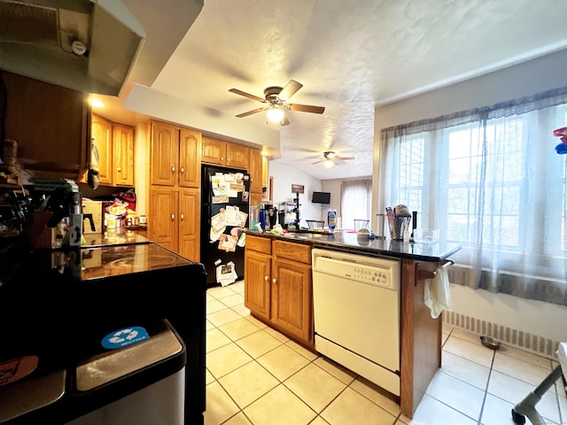 29 Hooker Rd, Bridgeport, CT 06610 - kitchen featuring dishwasher, freestanding refrigerator, light tile patterned floors, ceiling fan, and dark countertops