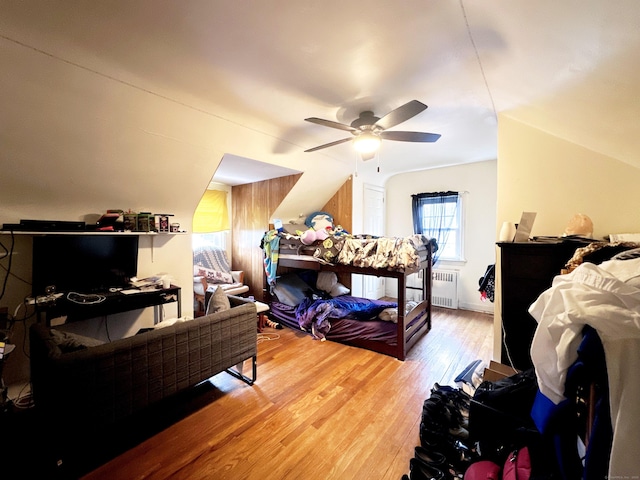 29 Hooker Rd, Bridgeport, CT 06610 - bedroom featuring radiator heating unit, wood finished floors, vaulted ceiling, and a ceiling fan