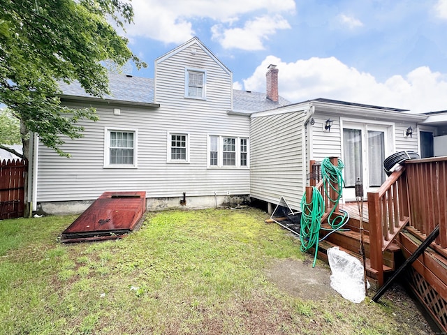29 Hooker Rd, Bridgeport, CT 06610 - rear view of property featuring a shingled roof, a chimney, and a lawn