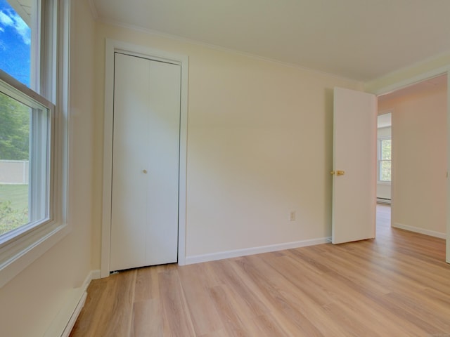 33 Homestead Rd, Ledyard, CT 06339 - unfurnished room with light wood-type flooring, plenty of natural light, crown molding, and baseboards