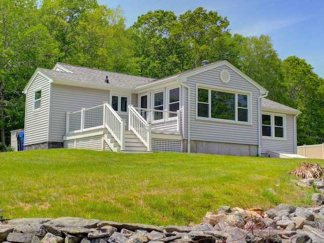 33 Homestead Rd, Ledyard, CT 06339 - back of property with a wooden deck, a lawn, and a shingled roof