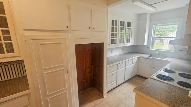 19 Weymouth Rd, Enfield, CT 06082 - kitchen featuring a sink, decorative backsplash, white cabinetry, and range