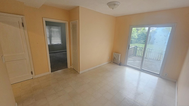 19 Weymouth Rd, Enfield, CT 06082 - empty room with radiator heating unit, baseboards, and light floors