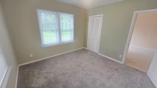 19 Weymouth Rd, Enfield, CT 06082 - unfurnished bedroom featuring carpet floors, a closet, and baseboards