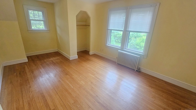 19 Weymouth Rd, Enfield, CT 06082 - unfurnished room featuring radiator, healthy amount of natural light, light wood-style floors, and baseboards