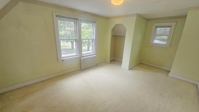 19 Weymouth Rd, Enfield, CT 06082 - unfurnished bedroom with radiator heating unit, arched walkways, light carpet, and baseboards