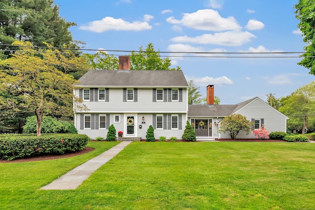 59 Ledyard Rd, West Hartford, CT 06117 - colonial inspired home featuring a chimney and a front lawn