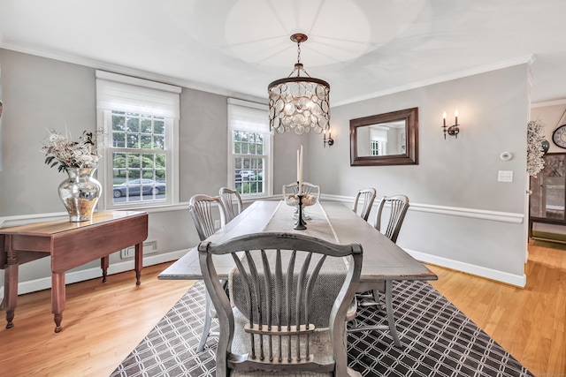 59 Ledyard Rd, West Hartford, CT 06117 - dining room featuring crown molding, light wood-style floors, baseboards, and a chandelier