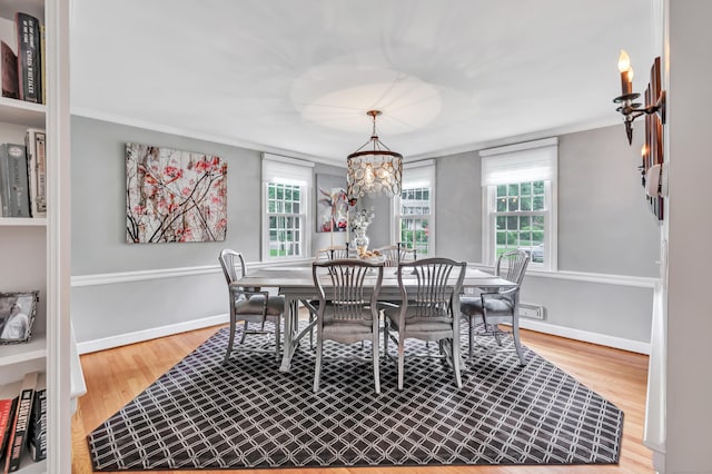 59 Ledyard Rd, West Hartford, CT 06117 - dining space featuring crown molding, wood finished floors, and a chandelier