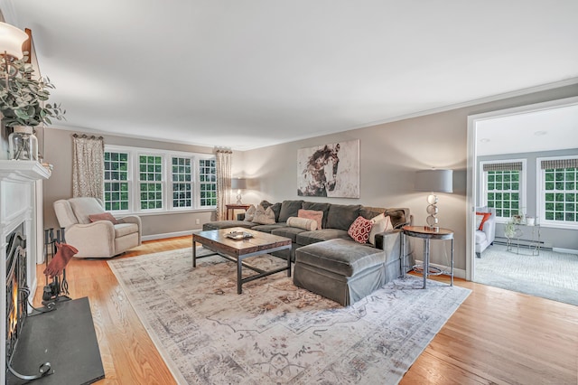 59 Ledyard Rd, West Hartford, CT 06117 - living area featuring plenty of natural light, ornamental molding, light wood-type flooring, and baseboards
