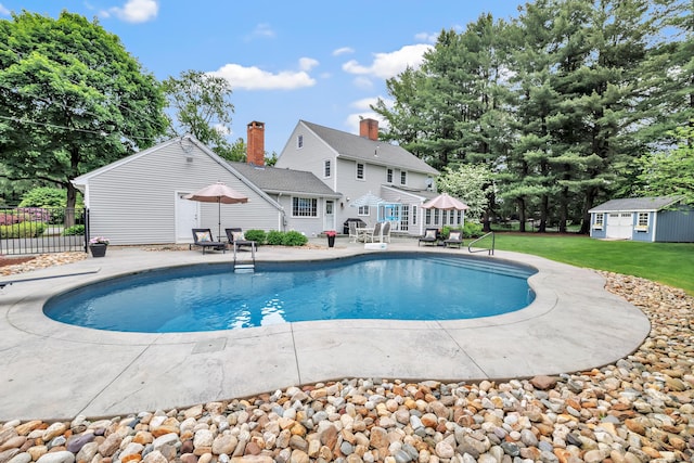 59 Ledyard Rd, West Hartford, CT 06117 - view of swimming pool with an outbuilding and a patio