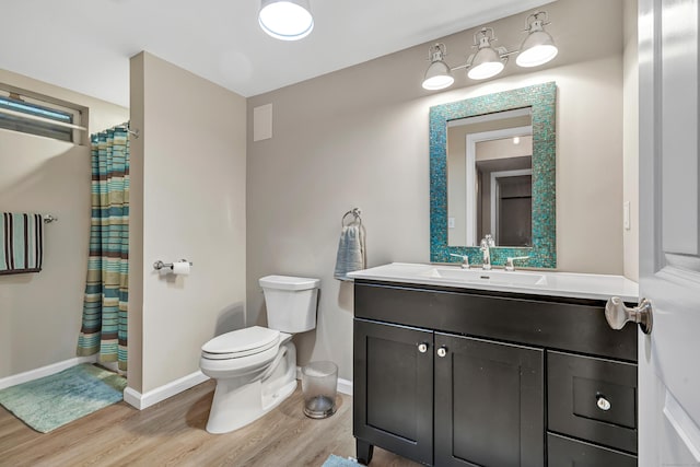 59 Ledyard Rd, West Hartford, CT 06117 - full bathroom featuring wood finished floors, toilet, vanity, baseboards, and curtained shower