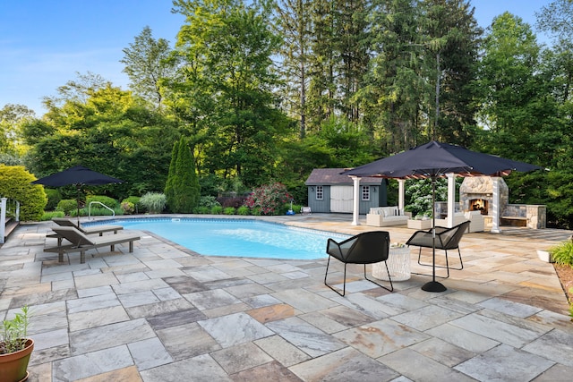 96 Norrans Ridge Dr, Ridgefield, CT 06877 - outdoor pool with an outdoor stone fireplace, a patio area, and an outdoor structure