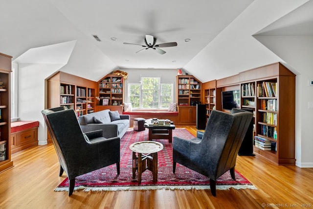 96 Norrans Ridge Dr, Ridgefield, CT 06877 - living area featuring built in features, light wood finished floors, vaulted ceiling, and a ceiling fan