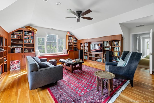 96 Norrans Ridge Dr, Ridgefield, CT 06877 - living room featuring wood finished floors, vaulted ceiling, built in features, and a ceiling fan