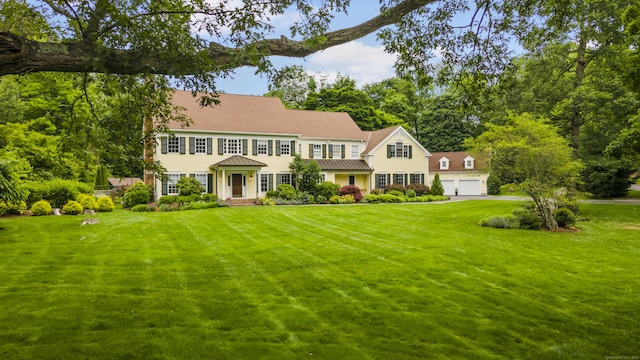 96 Norrans Ridge Dr, Ridgefield, CT 06877 - view of front of property with a garage, a front yard, and a standing seam roof