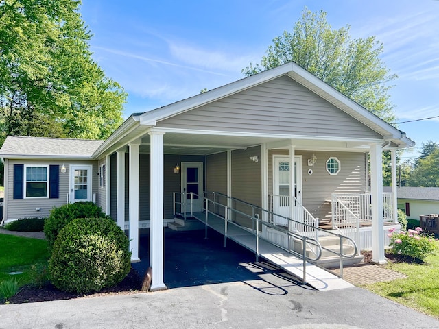 4 Cedar Grove Rd, Southington, CT 06489 - view of front of property with driveway and a carport