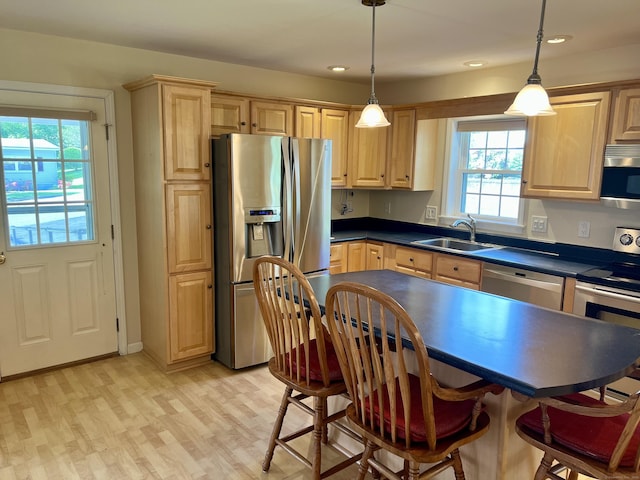 4 Cedar Grove Rd, Southington, CT 06489 - kitchen with stainless steel appliances, a sink, dark countertops, light brown cabinetry, and light wood-type flooring
