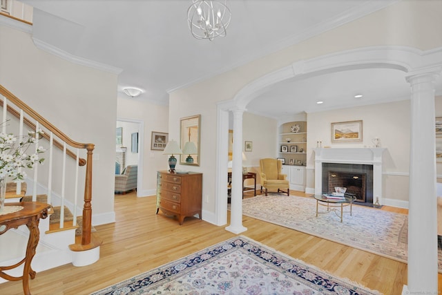 14 Withe Pass, Burlington, CT 06013 - foyer featuring ornate columns, wood finished floors, arched walkways, and crown molding