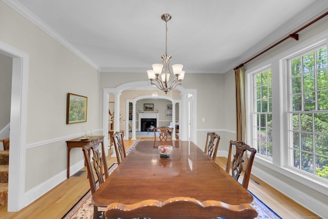14 Withe Pass, Burlington, CT 06013 - dining room featuring healthy amount of natural light, light wood finished floors, baseboards, and crown molding