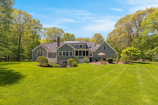 14 Withe Pass, Burlington, CT 06013 - back of property featuring a sunroom, a lawn, and a chimney