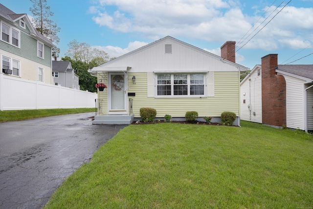 36 Rockwell Ave, Bristol, CT 06010 - view of front of property featuring asphalt driveway and a chimney