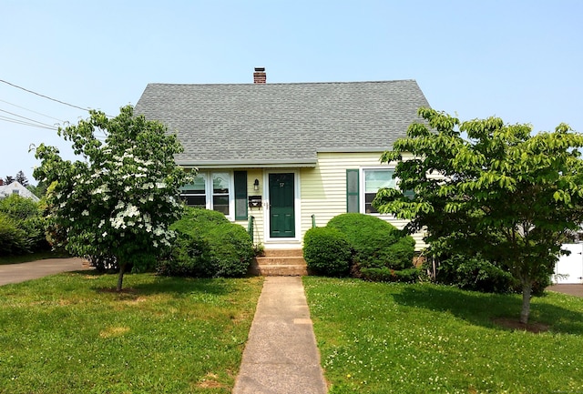 57 Fenway Dr, Hamden, CT 06517 - cape cod house featuring a front lawn, a chimney, and a shingled roof
