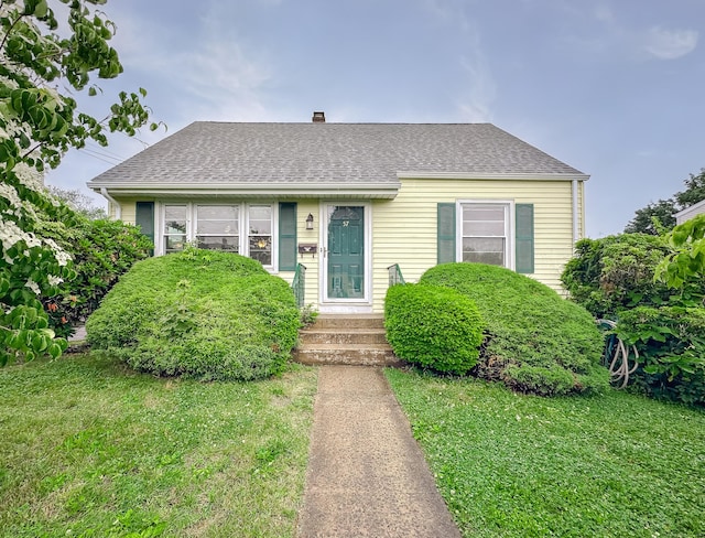 57 Fenway Dr, Hamden, CT 06517 - view of front of home with a front lawn, roof with shingles, and a chimney