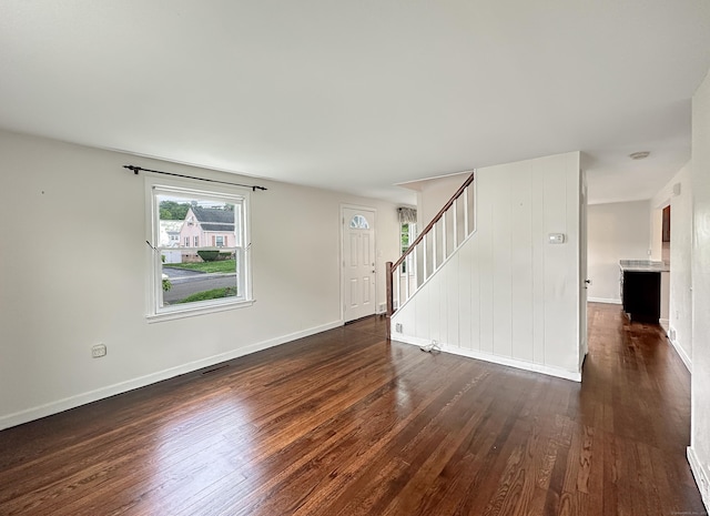 57 Fenway Dr, Hamden, CT 06517 - unfurnished living room with dark wood-style flooring and stairway