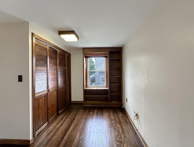 57 Fenway Dr, Hamden, CT 06517 - unfurnished bedroom with dark wood-style flooring and a closet