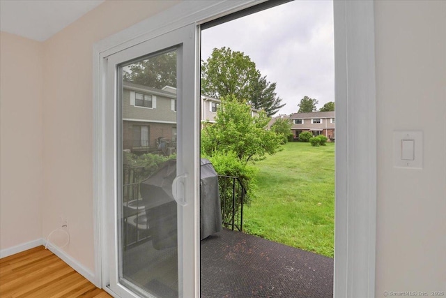 165 Hampton Ct Unit 165, Newington, CT 06111 - doorway to outside with wood finished floors and baseboards