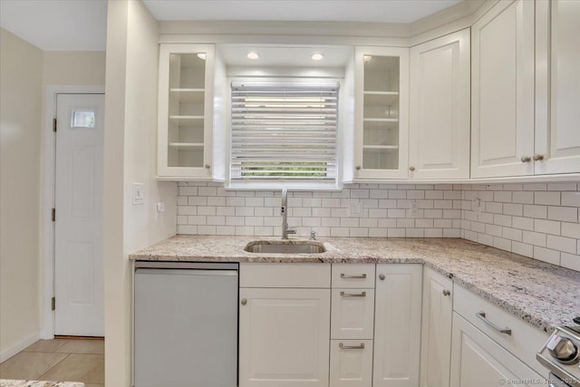 165 Hampton Ct Unit 165, Newington, CT 06111 - kitchen featuring a sink, stainless steel dishwasher, white cabinets, and decorative backsplash