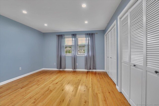 165 Hampton Ct Unit 165, Newington, CT 06111 - unfurnished bedroom featuring light wood-style floors, baseboards, and recessed lighting