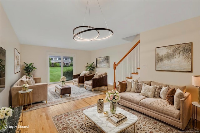 165 Hampton Ct Unit 165, Newington, CT 06111 - living room with light wood-type flooring, stairway, and a chandelier